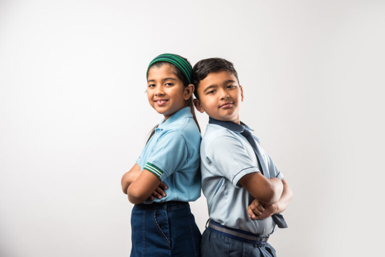 cheerful-indian-school-kids-uniform-standing-isolated-white-background